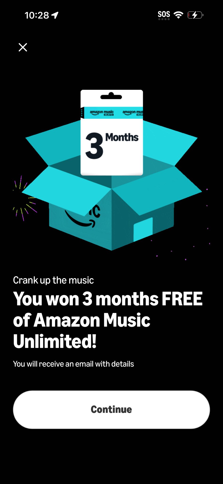 A FanQuest win-state screen — 'Crank up the music: You won 3 months FREE of Amazon Music Unlimited!' with an animated gift box revealing the gift card.