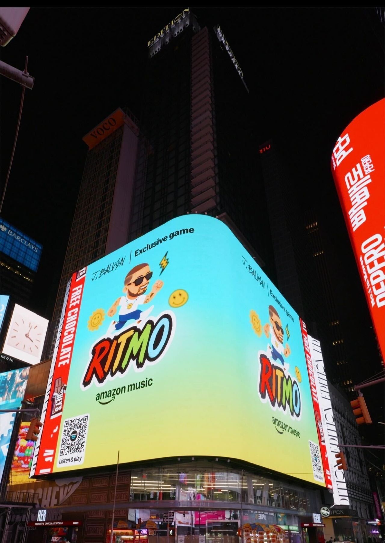 Ritmo wraparound billboard in Times Square, NYC — Exclusive game, RITMO, Amazon Music, with a Listen & play QR code.